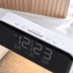 Close-up of the Clérachic bedside station's snooze and alarm buttons above the LED display.