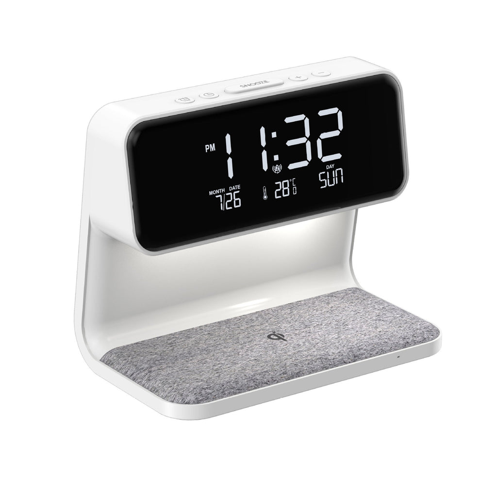 The Clérachic bedside station on white, showing the clock face and fabric charging pad.