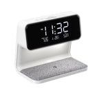 The Clérachic bedside station on white, showing the clock face and fabric charging pad.