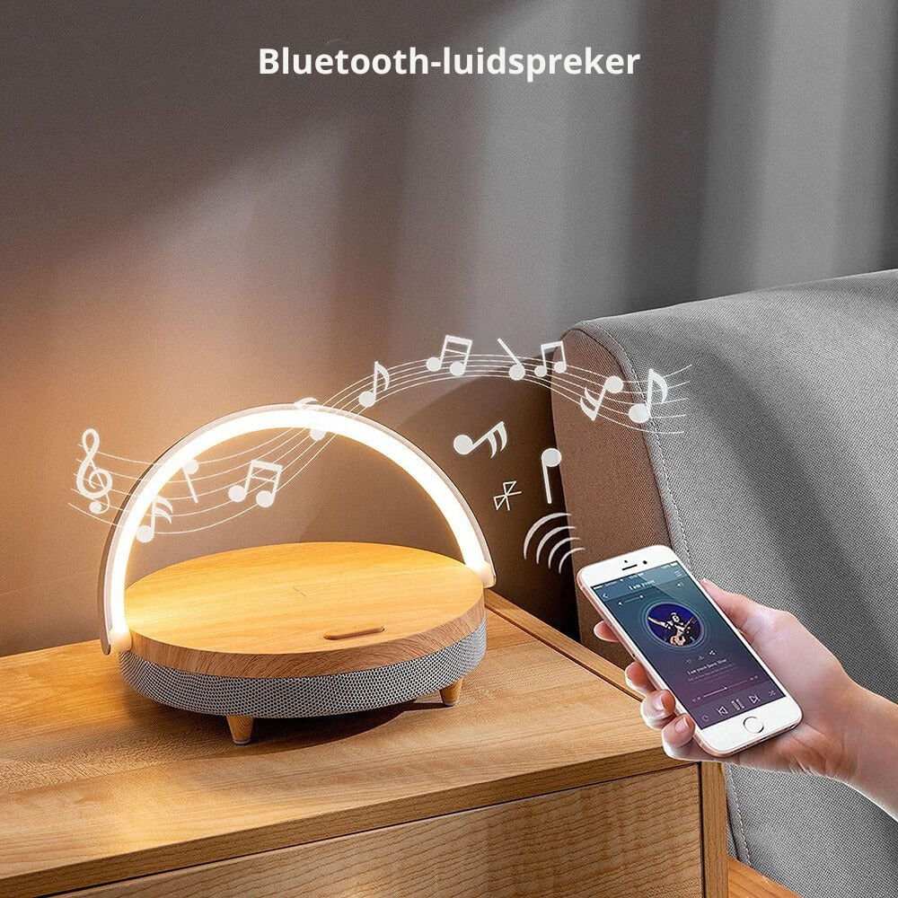 The Clérachic lamp lit on a bedside table, music notes drawn to show its Bluetooth speaker.