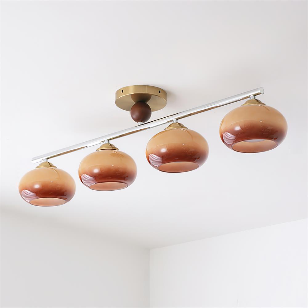 Clérachic 4-Dome Glass Bar Ceiling Light in caramel, unlit, showing the rose-brown glass and pale pink swirl through each lower third.
