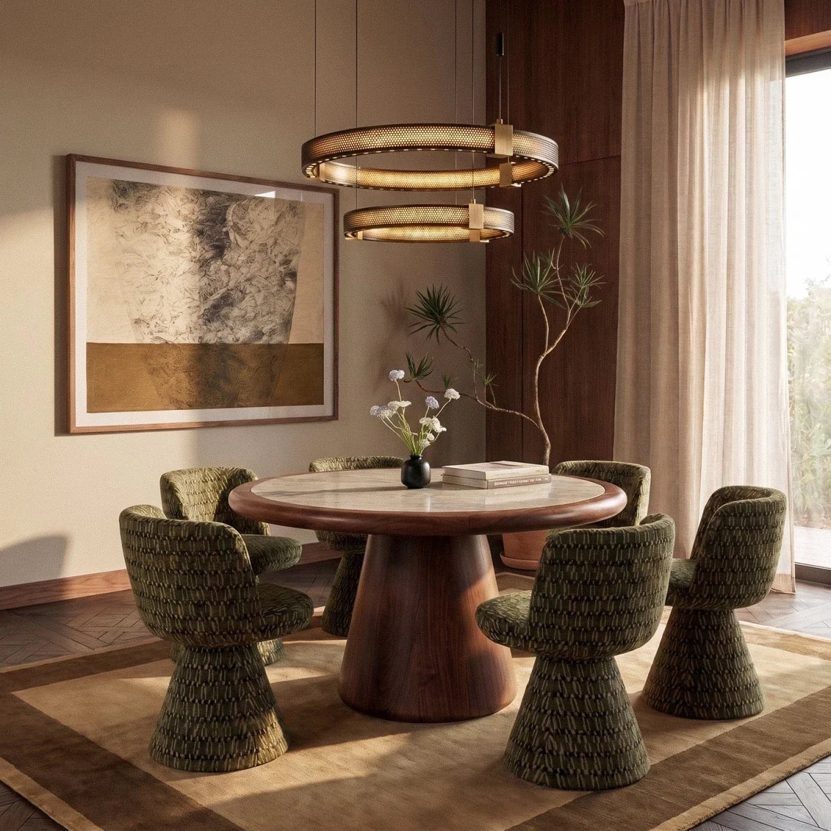 Clérachic two-tier ring chandelier lit warm above a round marble dining table with green upholstered chairs.