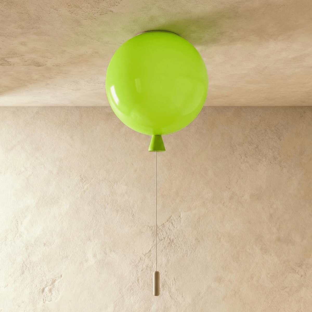 Clérachic round green ceiling light shaped like a balloon, switched off, with a green cone neck and a slim pull cord with a wooden toggle.