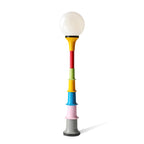 White globe on a yellow funnel and multicolour tiers, a Clérachic floor lamp on a white background.