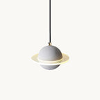 Grey speckled sphere with a glowing clear ring around it, hanging from a black cord, this Clérachic pendant light on a plain white backdrop.