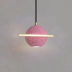 Sand pink Clérachic pendant with a flat glowing ring and a downlight, with a soft pool of light on the wall below.
