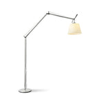 Clérachic floor lamp on a white backdrop, its silver arm folded at the joints and its shade facing right above a round base.