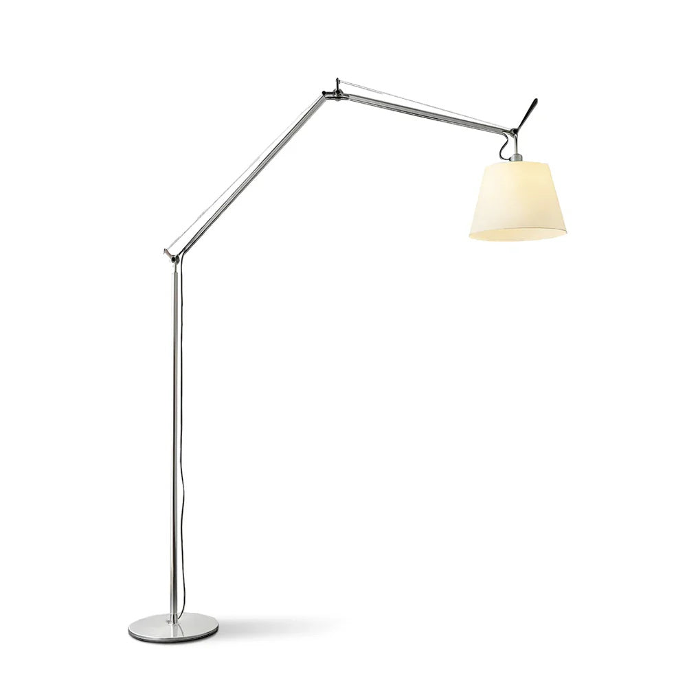 Clérachic floor lamp on a white backdrop, its silver arm folded at the joints and its shade facing right above a round base.
