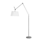 Clérachic floor lamp on a white backdrop with the shade swung to the left of its folded silver arm, above a round base.