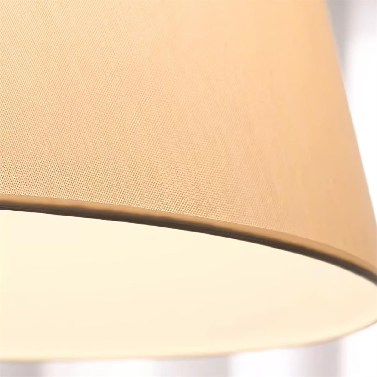 Close view of the fine fabric weave on the lit shade of this Clérachic floor lamp.