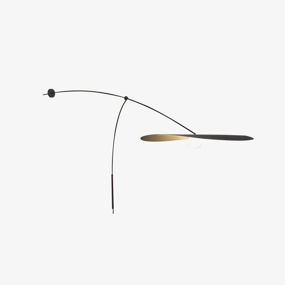 Side view of a Clérachic wall light on white, the shade tipped almost edge-on to show its thin black and gold profile.