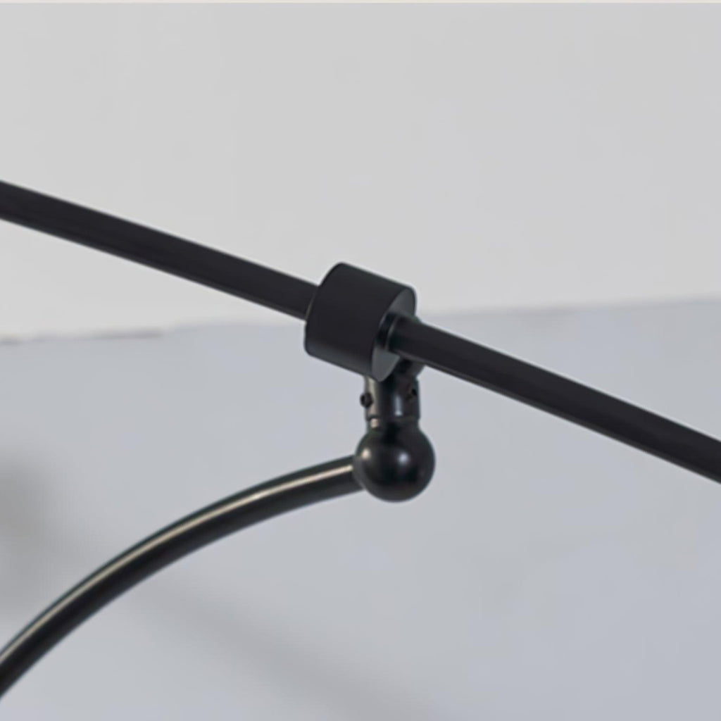 Close view of the swivel joint and collar on the black arm of this Clérachic wall light.