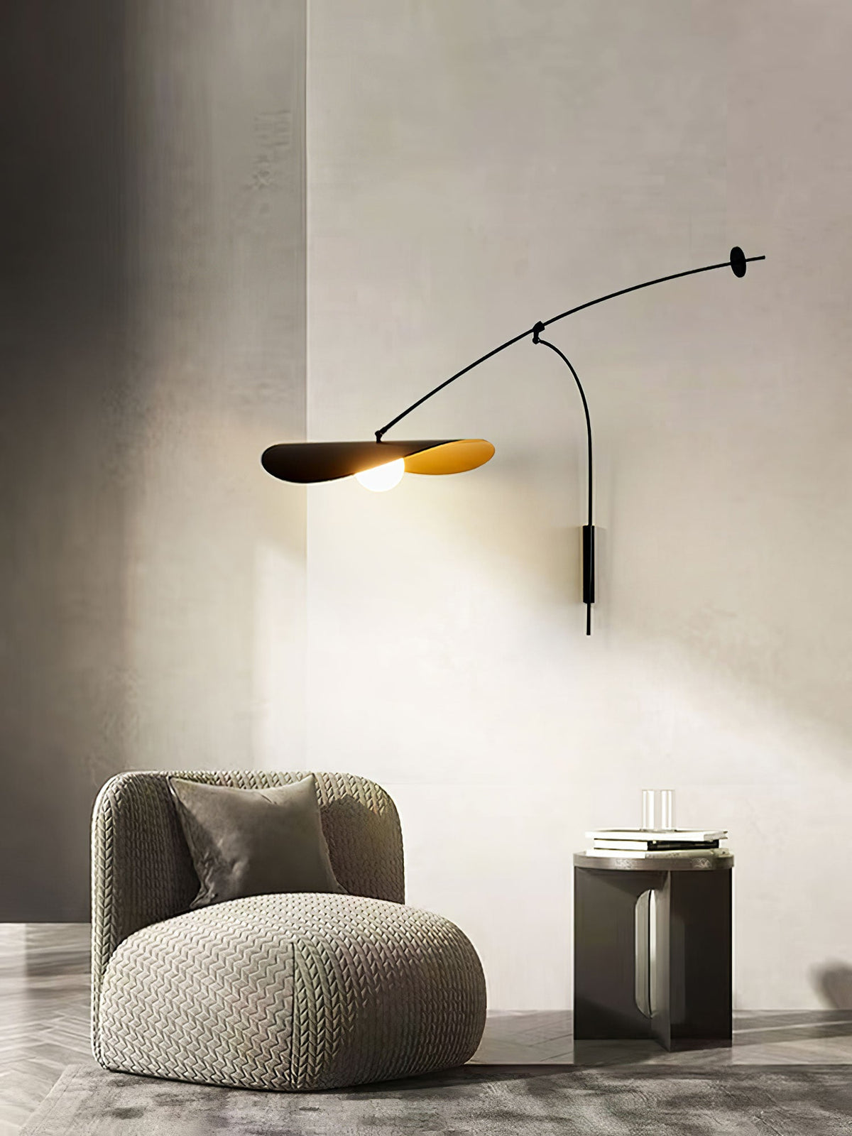 Beside a boucle armchair and a dark side table, this Clérachic wall light shines in a corner of cream wall.
