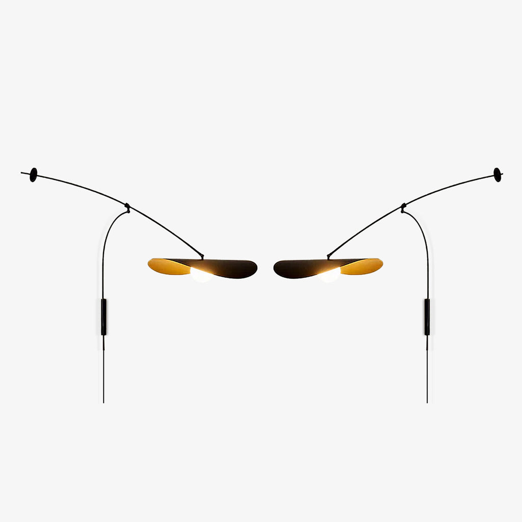 Two Clérachic wall lights shown as a mirrored left and right pair on light grey, each with a gold-lined shade.