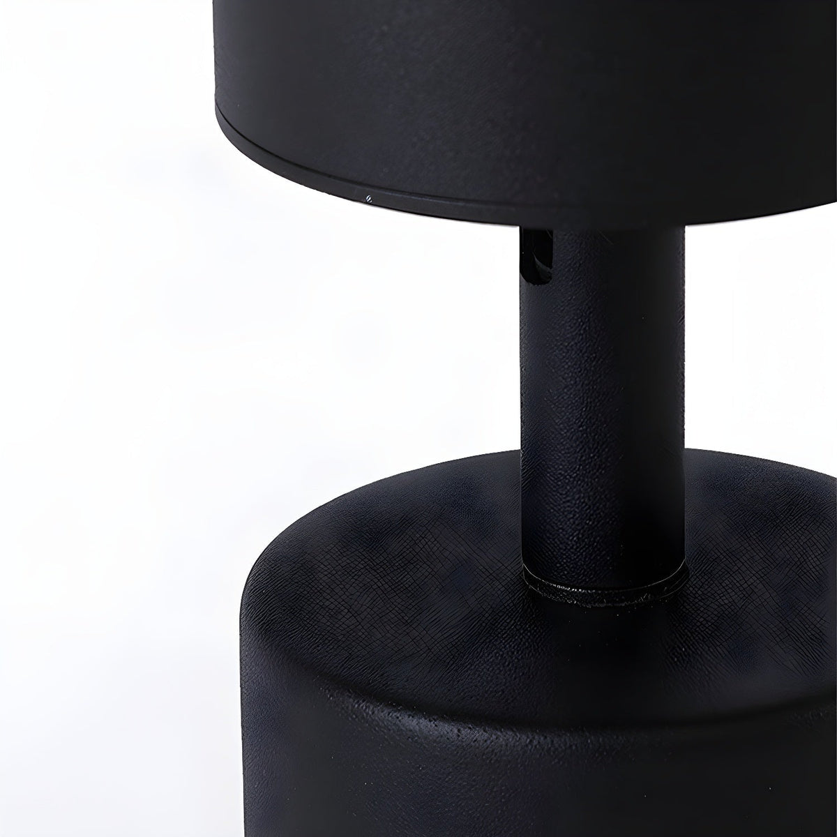 Close view of the black stem where the cylinder meets the canopy on this Clérachic spotlight, with a matt finish.
