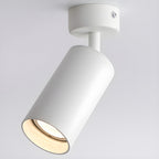 White Clérachic spotlight seen from below and to the side, with the cylinder pointed down and light filling the shade.