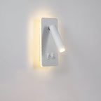 The Clérachic reading wall light in white, spot angled down beside the glowing backplate.