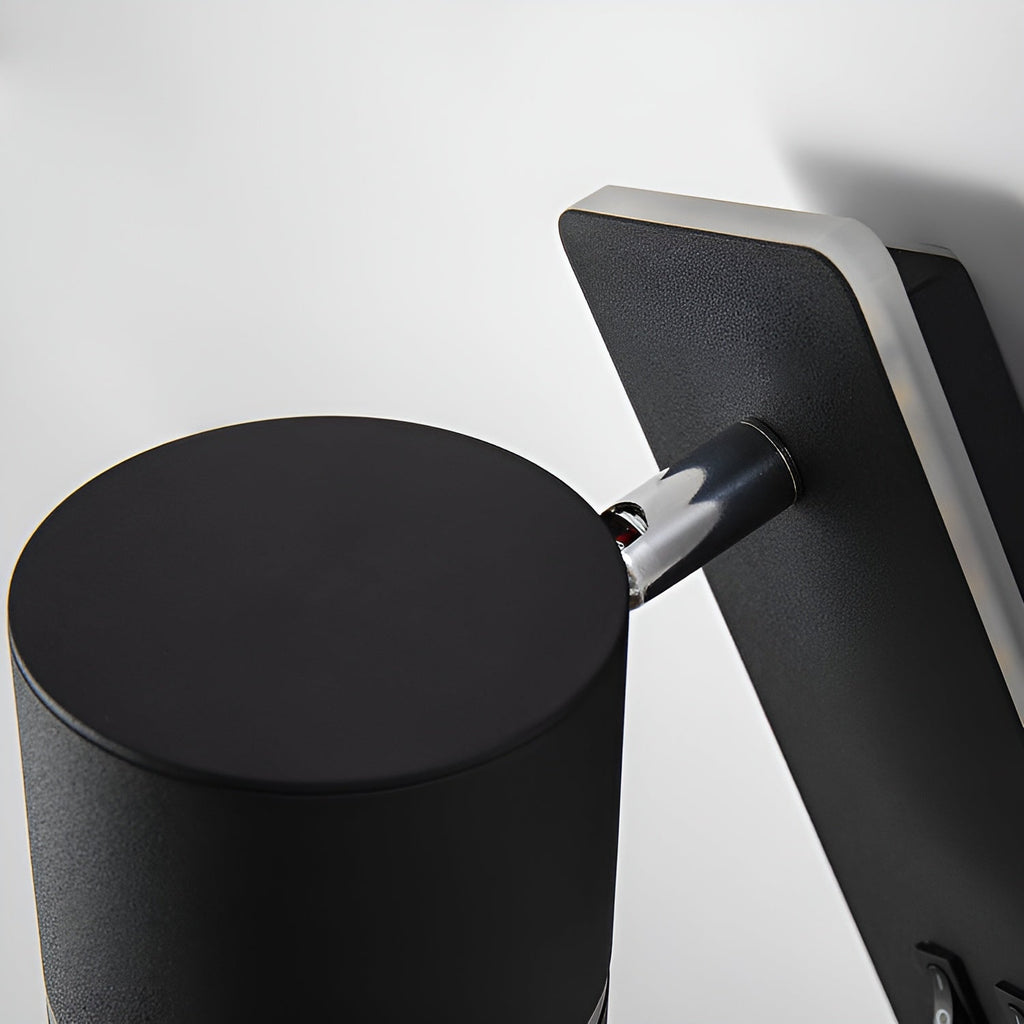 Close-up of the Clérachic reading light's rotating cylinder head and chrome swivel joint.