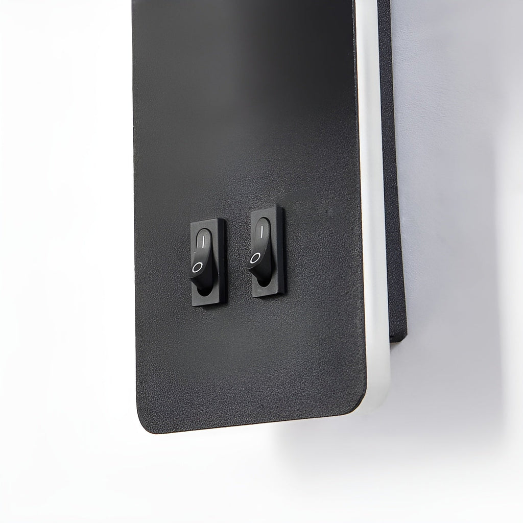 Close-up of the Clérachic reading light's two rocker switches on the black backplate.