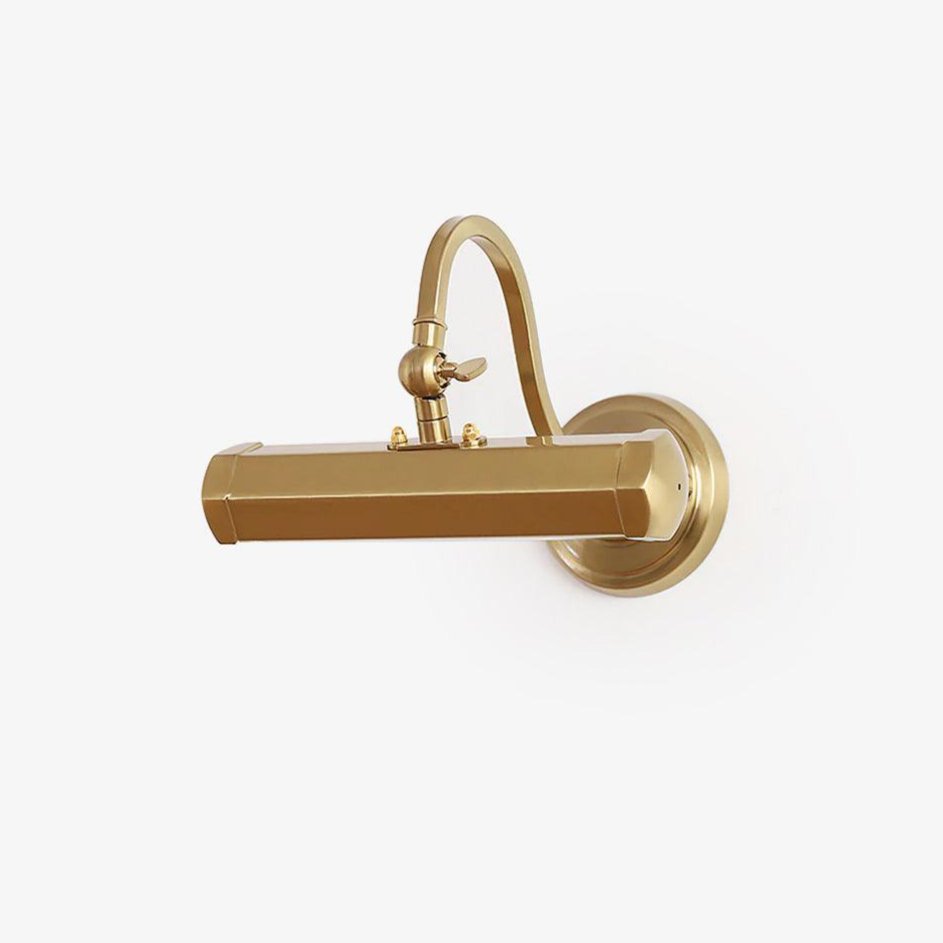 Gold Clérachic picture light with a hexagonal bar shade and a curved swan-neck arm, on a round wall plate, against a plain white wall.