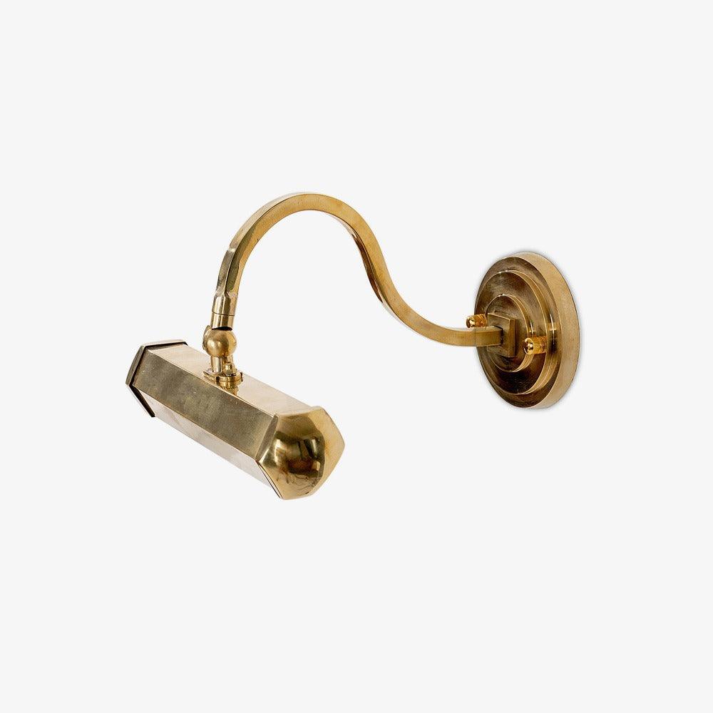 Gold swan-neck arm and angled hexagonal shade on this Clérachic wall light, on a soft grey studio backdrop.