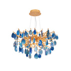 Blue agate Clérachic chandelier on a plain white backdrop, with a round gold canopy and a dense cluster of teardrop slices.