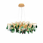 Green agate Clérachic chandelier on a white backdrop, with deep green slices hanging from a wide gold branch frame.