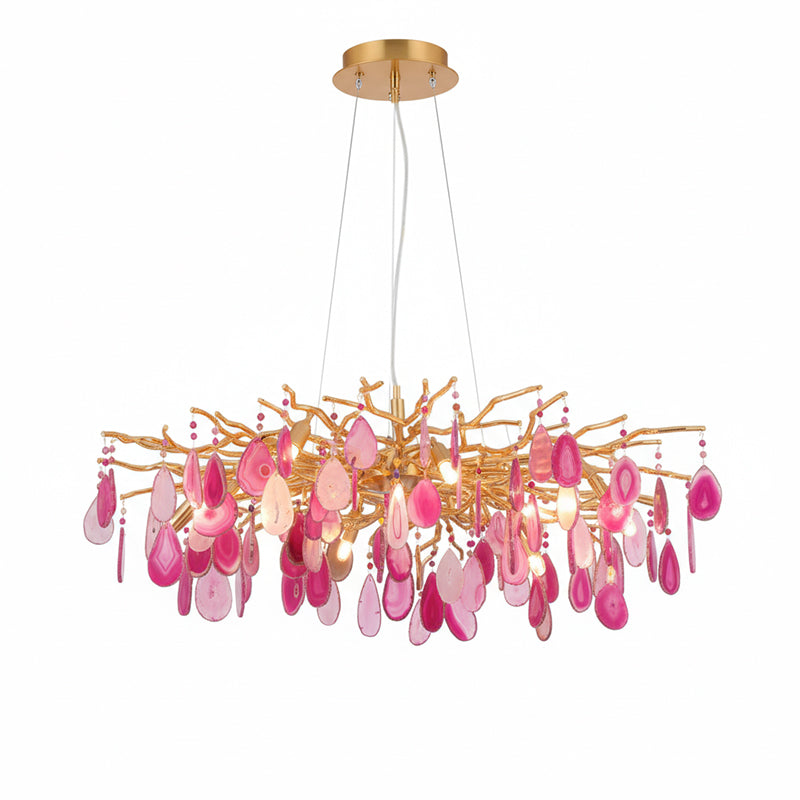 Pink agate Clérachic chandelier on a white backdrop, with rose and magenta slices hanging from a wide gold frame.