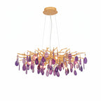 Purple agate Clérachic chandelier on a white backdrop, with violet slices hanging from a wide gold branch frame.