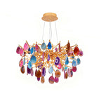 Compact multicolour agate Clérachic chandelier on a white backdrop, with pink, blue, orange and purple slices around a gold hub.
