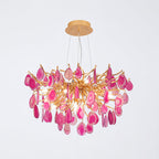 Compact pink agate Clérachic chandelier on a pale backdrop, with magenta and rose slices around a gold branch centre.