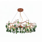 Green-slice Clérachic agate chandelier on a white backdrop, with deep green stones and small bulbs among the branches.