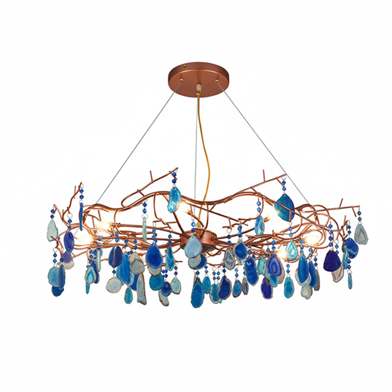 Blue-slice Clérachic agate chandelier on a white backdrop, with navy and light blue stones hanging below the branches.