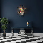 This Clérachic agate wall light lit against a navy wall, above a mirrored console on a black and white hexagon floor.