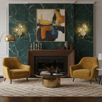 Two golden Clérachic agate wall lights on green marble either side of an abstract painting, above a fireplace and two mustard armchairs.