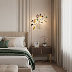 Multicolour Clérachic agate wall light lit above a bedside table with an orchid, beside tall cream curtains.