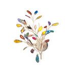 Multicolour agate slices fan out in all directions from the gold back plate of this Clérachic wall light on a white backdrop.