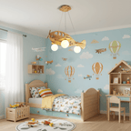 A Clérachic wooden airplane light over a pale blue nursery wall painted with hot air balloons, beside a small wooden bed and play house.