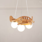 Low-angle view of the Clérachic airplane light under a plain ceiling with a ribbed cornice, its three globes lit and its wood grain visible.