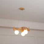 Distant view of this Clérachic wooden airplane light in a room with ornate cornice mouldings and panelled walls.
