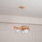 A Clérachic wooden airplane light switched off, hung in a panelled room with its cloud-shaped canopy and three wires above.