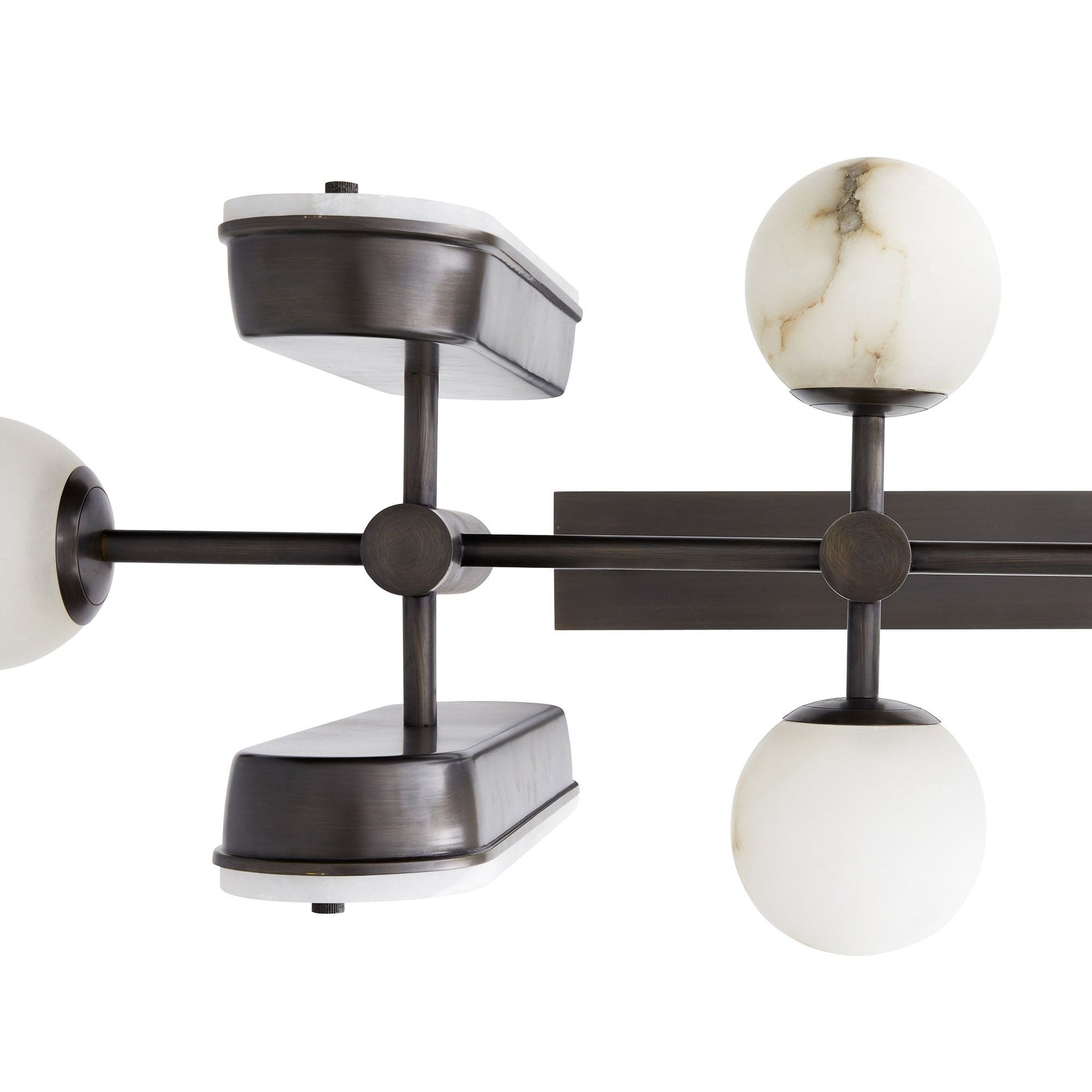 Close detail of the Clérachic Alabaster 5-Light Linear Island Pendant, showing the machined bronze cross joints and grey-veined stone globes.