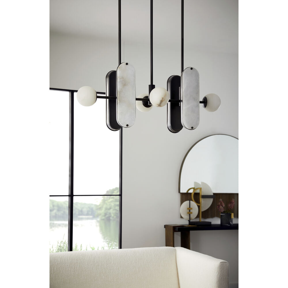 Clérachic Alabaster 5-Light Linear Island Pendant seen from below in a bright room, its stone shades reading soft grey against a white wall.