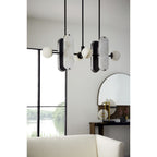 Clérachic Alabaster 5-Light Linear Island Pendant seen from below in a bright room, its stone shades reading soft grey against a white wall.