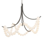 The Clérachic Alabaster Bead Chandelier in brushed nickel, cool grey arms holding the same glowing strands of stone beads.