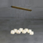 The nine-cube Clérachic box chandelier, alabaster boxes staggered along a long brass bar.