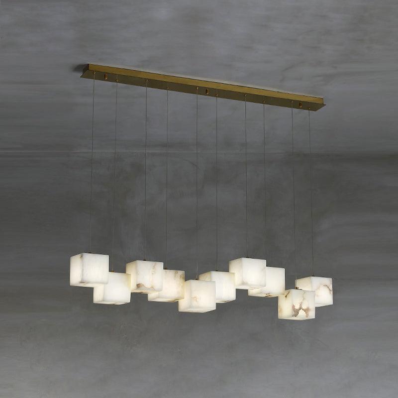 Clérachic box chandelier with eleven cubes spread across a wide brass ceiling plate.