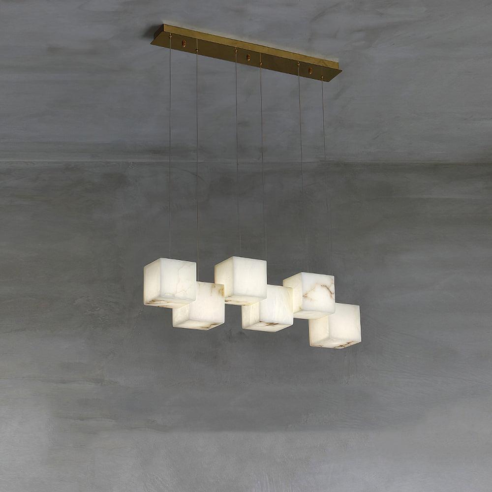 Clérachic alabaster box pendant, six cube shades on cables from a brass ceiling bar.