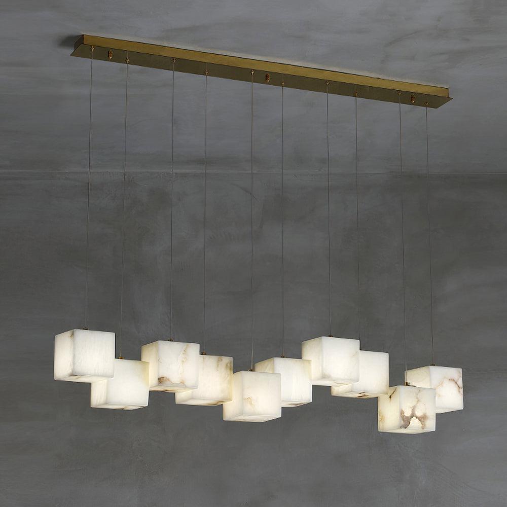 Clérachic box pendant at fifteen cubes, spread across a wide brass ceiling plate.