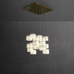 Clérachic box pendant in a square cluster, cubes massed below a brass ceiling plate.